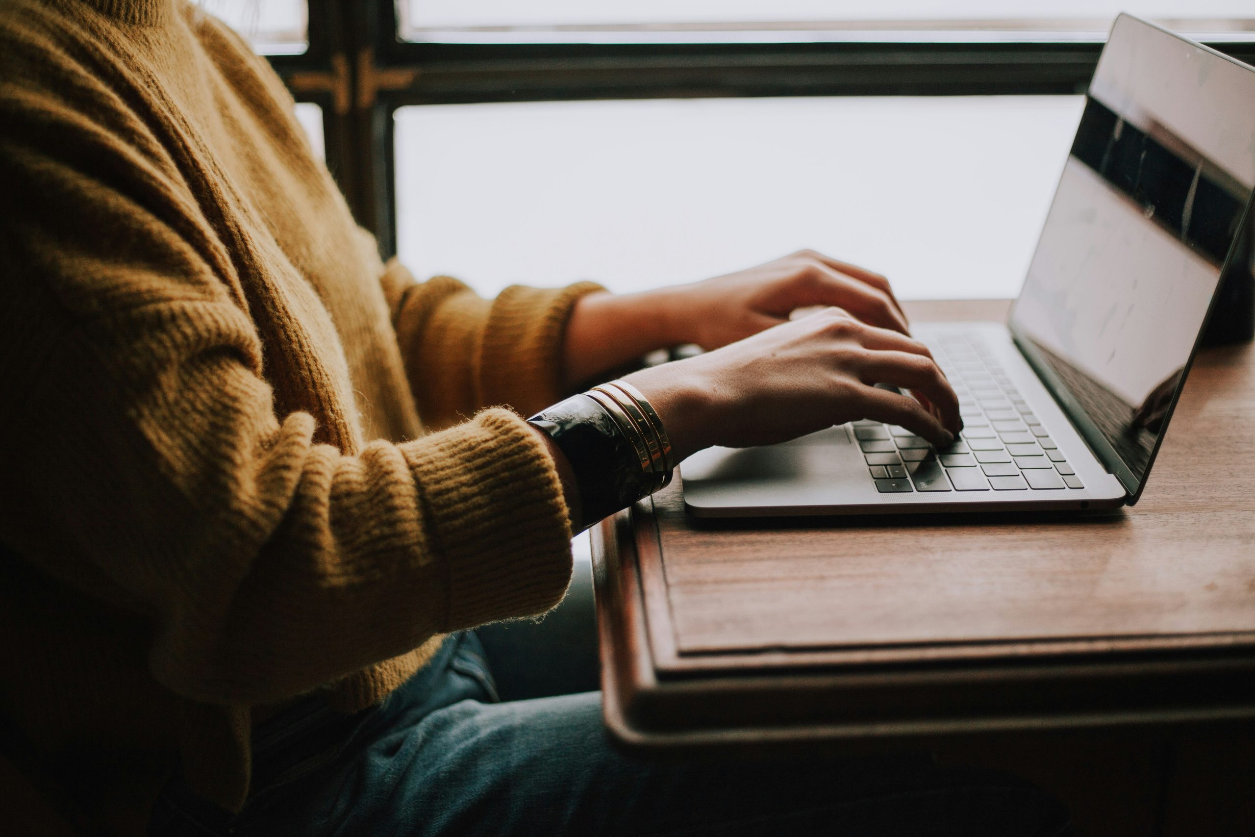 A person watching financial education content on a laptop